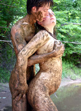 Bodacious photo session of nude guy and a girl in mud